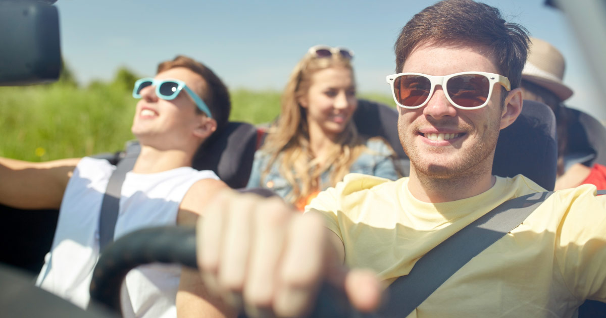 Group of Teens Driving in a Convertible Car