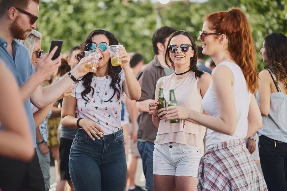 college students drinking outside at a party