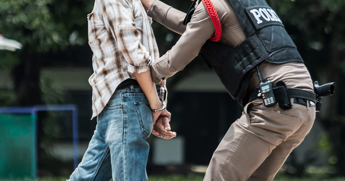 Boy being arrested for underage drinking
