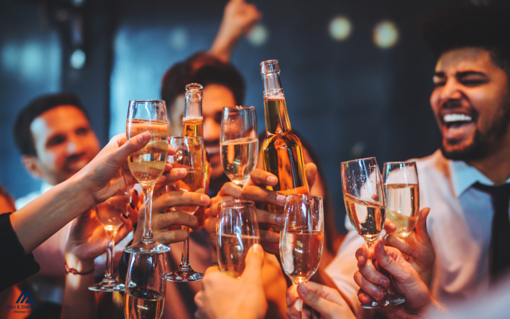 A group of friends making a toast with sparkling wine and beer.