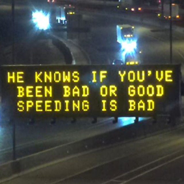 ADOT freeway sign that says, "He knows if you've been bad or good speeding is bad."