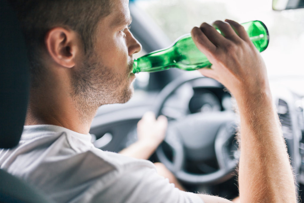 Drunk Man in Arizona Driving With Open Liquor Bottle