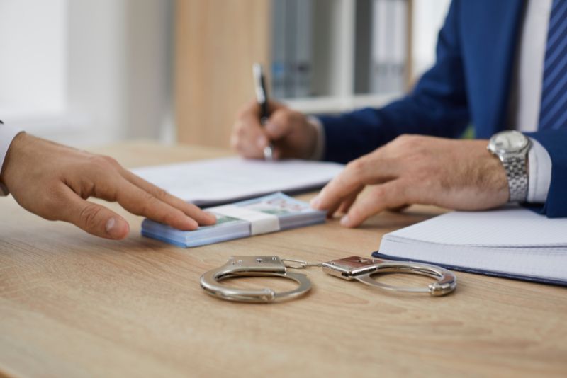lawyer submitting bail payment on behalf of client