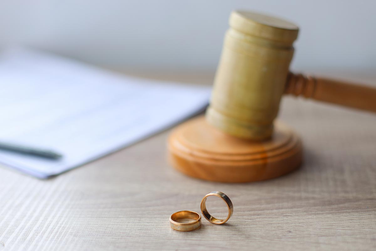 Gavel and 2 Wedding Rings on Table