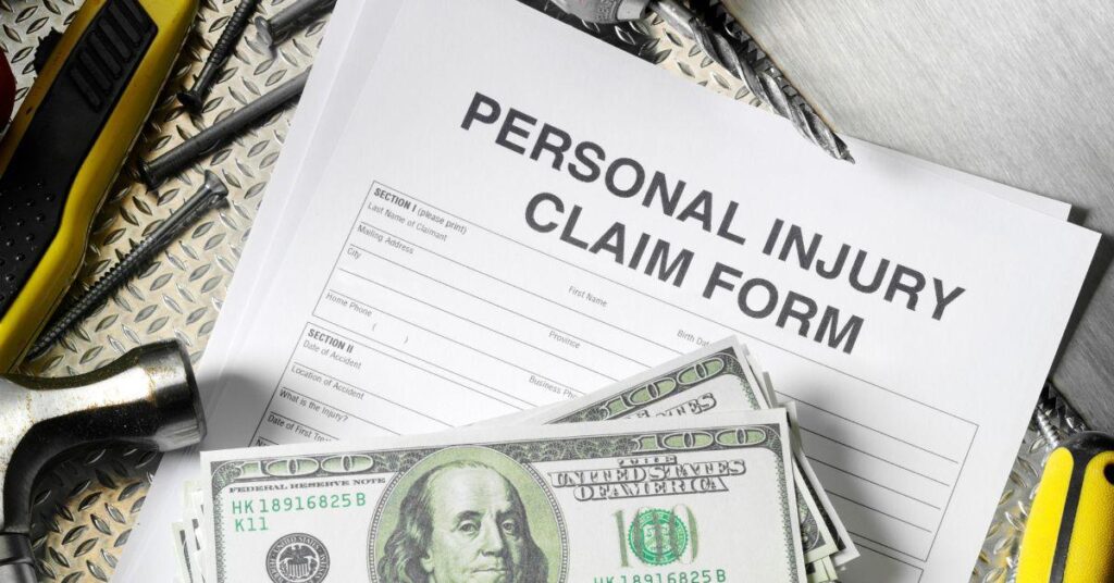 personal injury claim form with hundred dollar bills