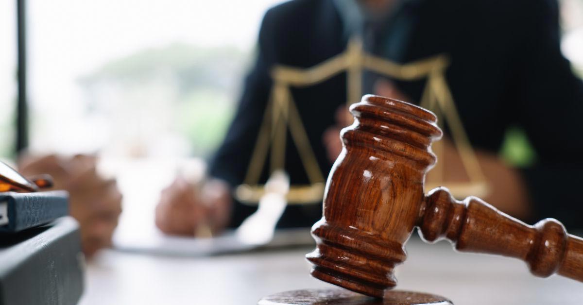 Gavel Resting on Desk in Lawyers Meeting