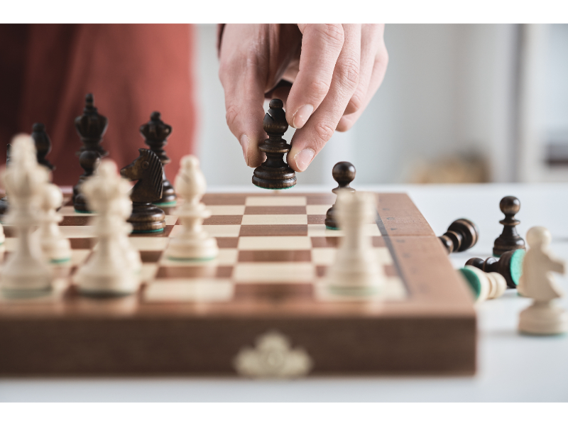 close-up of someone playing chess