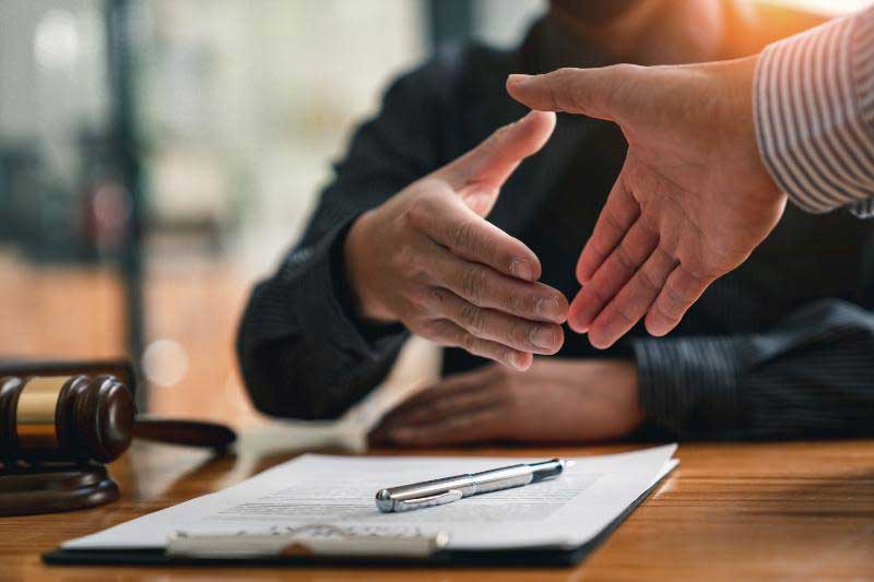 Lawyer Shaking Hands with Client