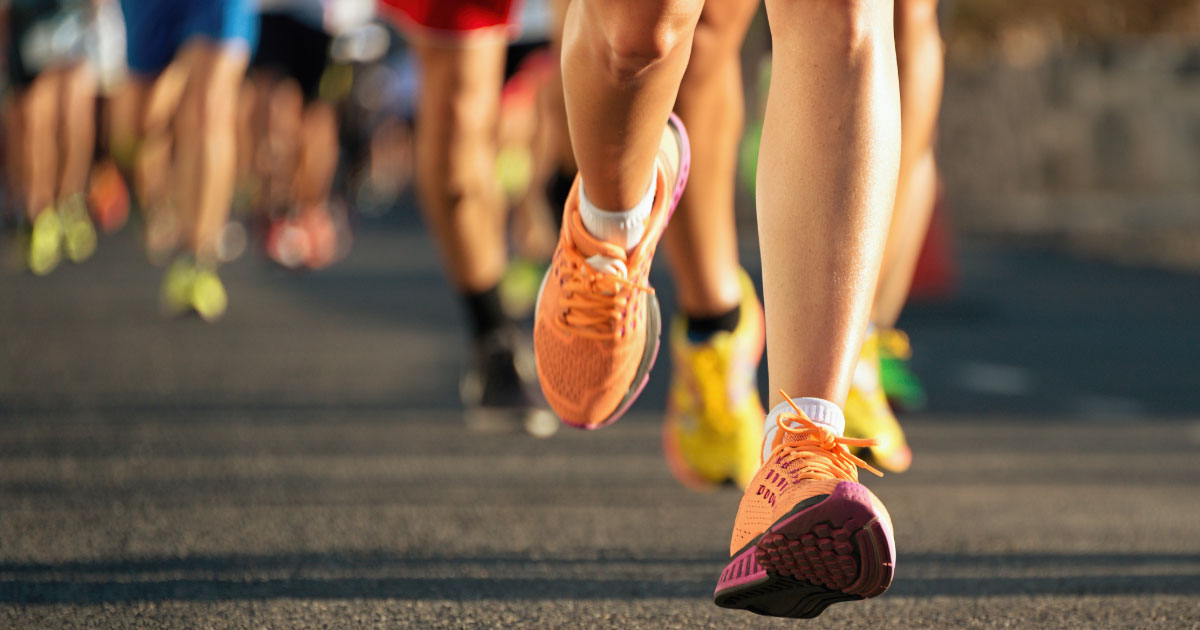 Running shoes of people in marathon