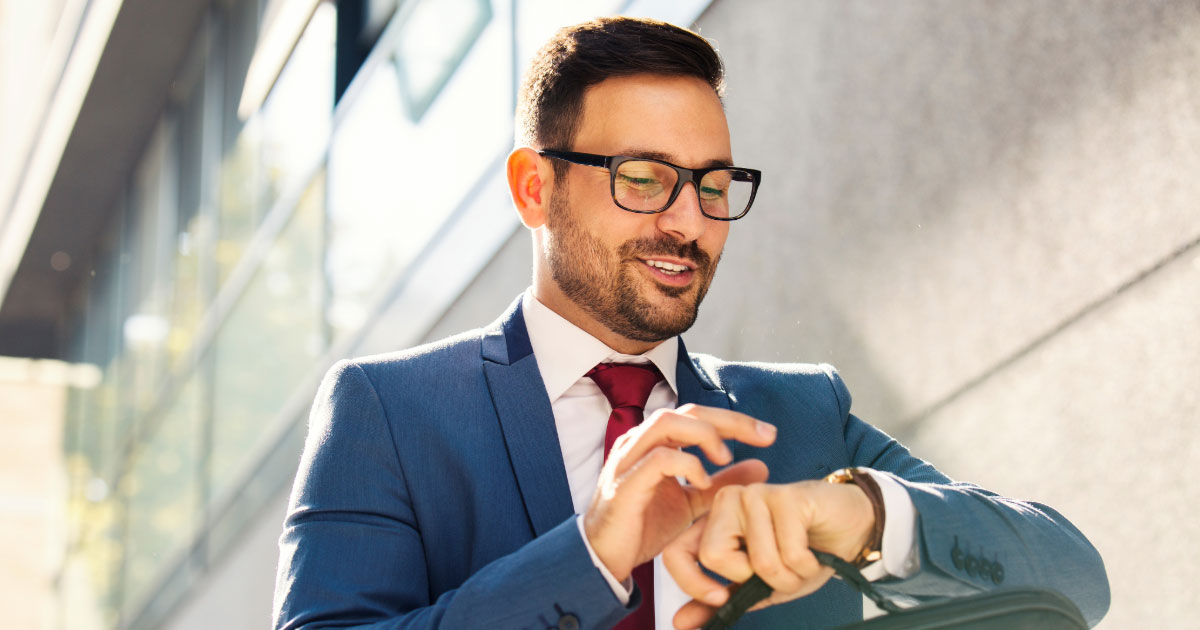 Man heading to court looking at his watch