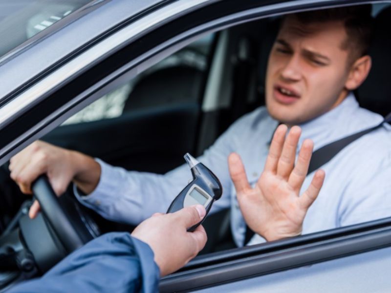 Driver refusing breathalyzer test from cop