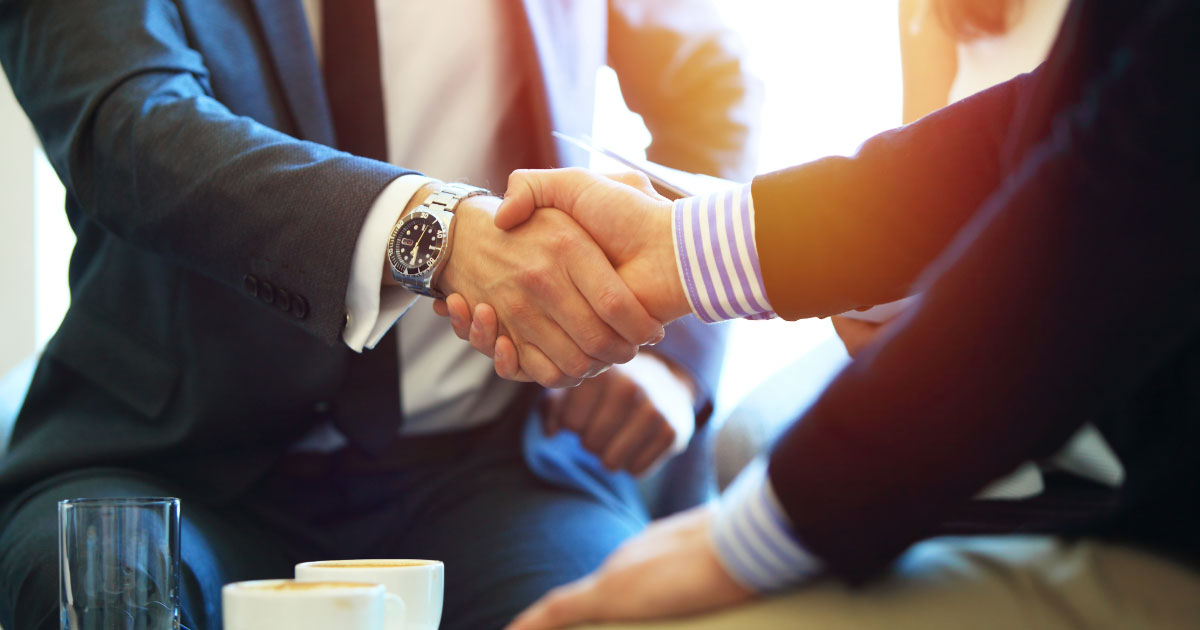 Lawyer shaking hands with family law client