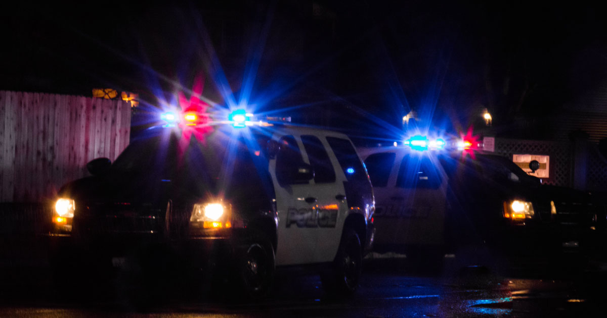 Police SUV with lights on at night