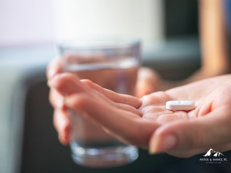 person taking a prescription drug