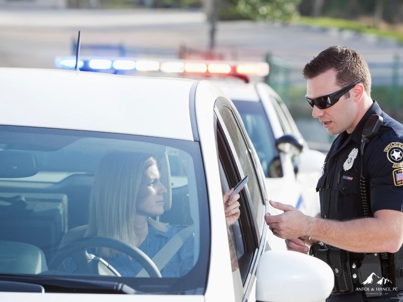 Police officer issuing a traffic citation to an Arizona driver